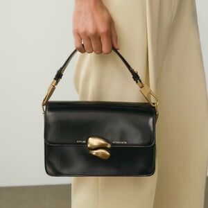 CHYLAK Leather Top-Handle Bag with Gold Accent.